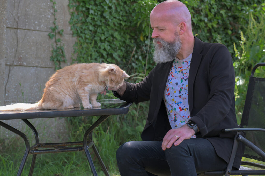 therapist mark gr sitting outside with pet