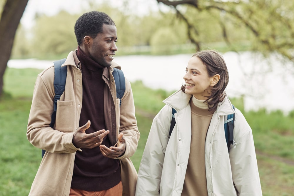 a man and a woman walking and chatting after therapy