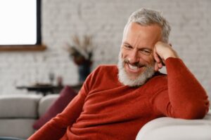 man smiling during therapy