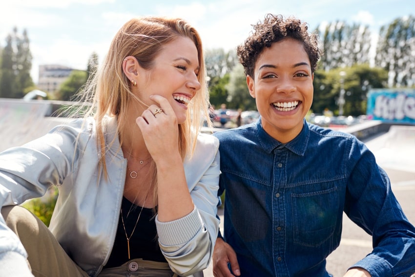 portrait of two female skateboarders