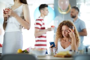 social anxiety solutions, woman feeling anxious in a party