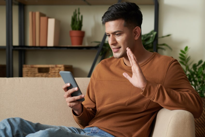 young man on phone having affordable online therapy with mark-min